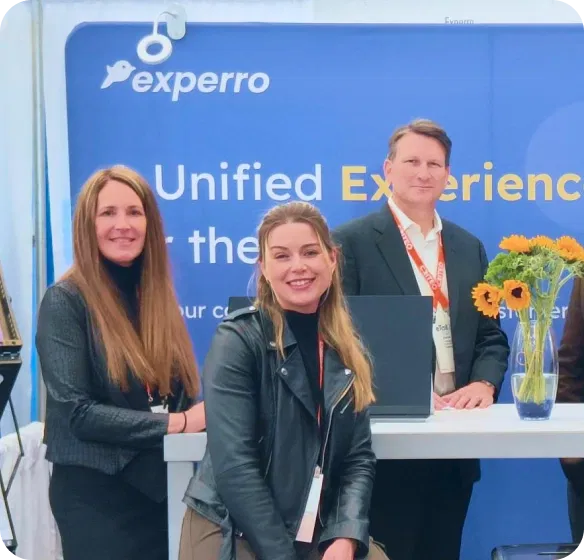 People at conference booth discussion